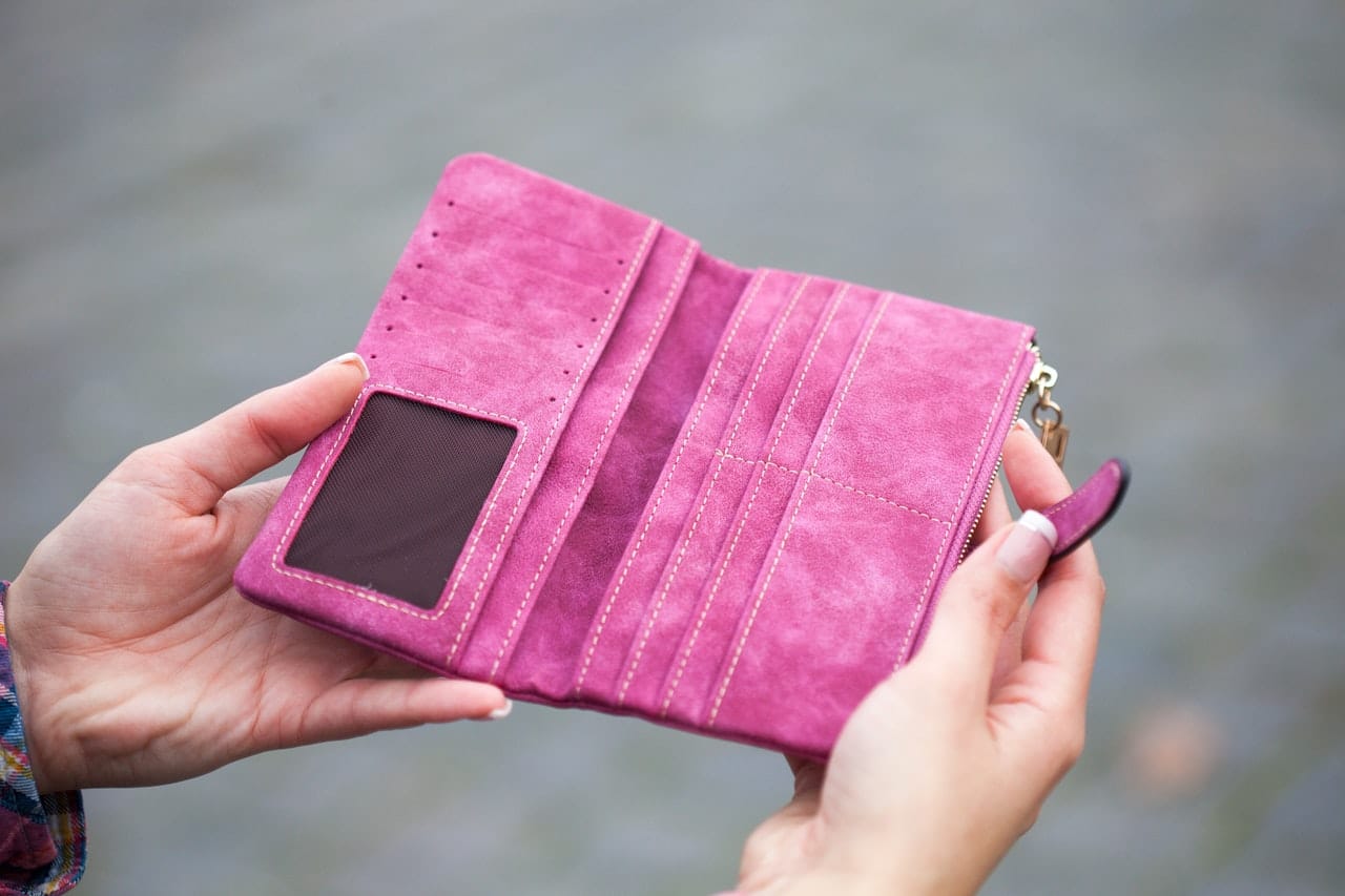 An empty wallet representing child and spousal support arrears in Alberta