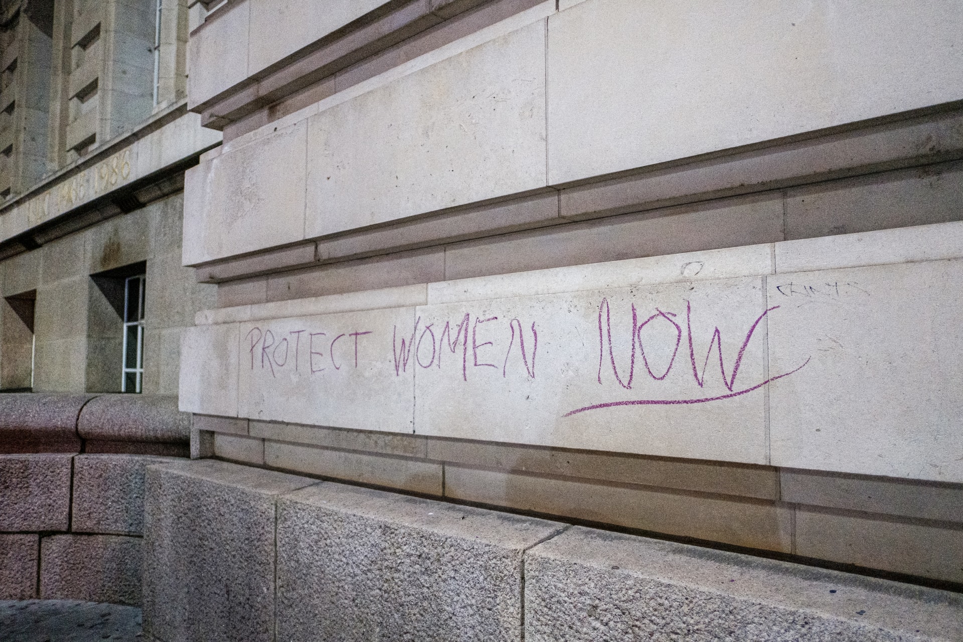 Graffiti that says Protect Women Now representing Clare's Law coming into force in Alberta