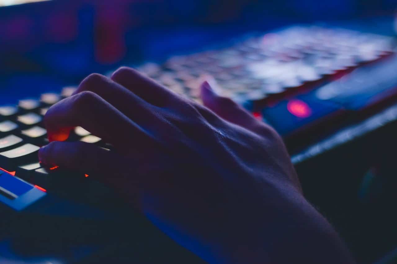 A person typing on a keyboard representing a new tort of public disclosure of private information