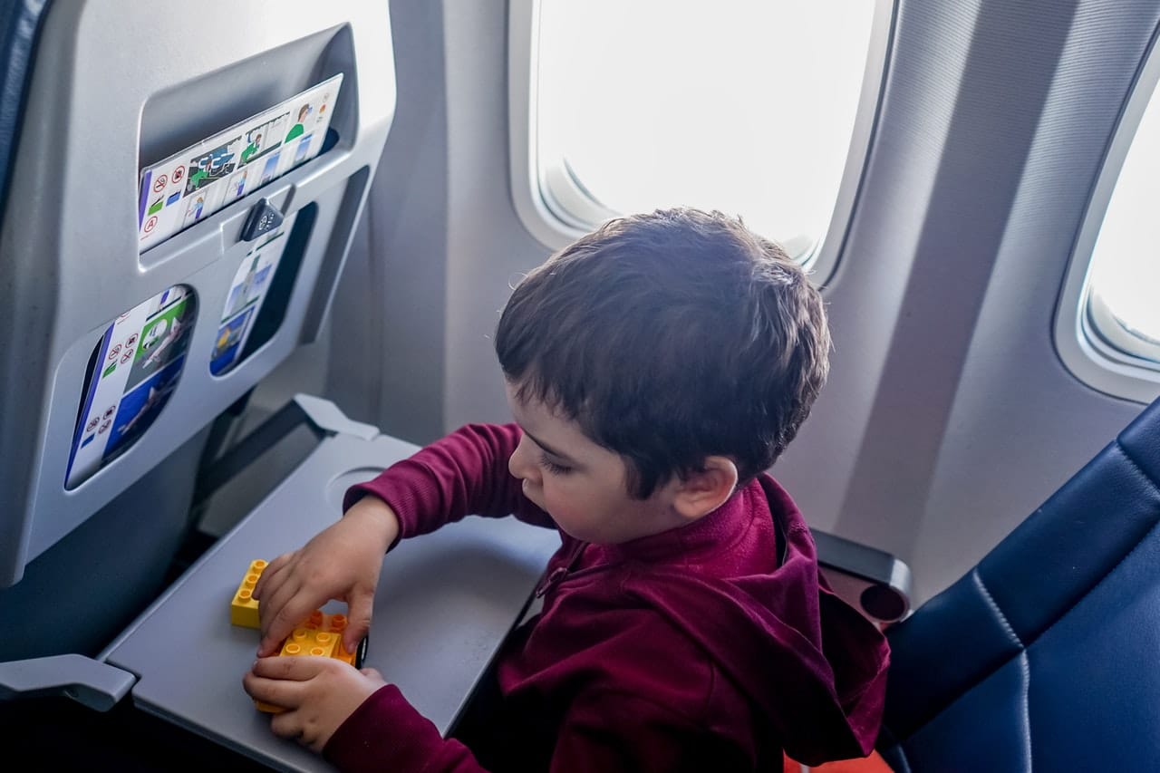 Child playing on plane