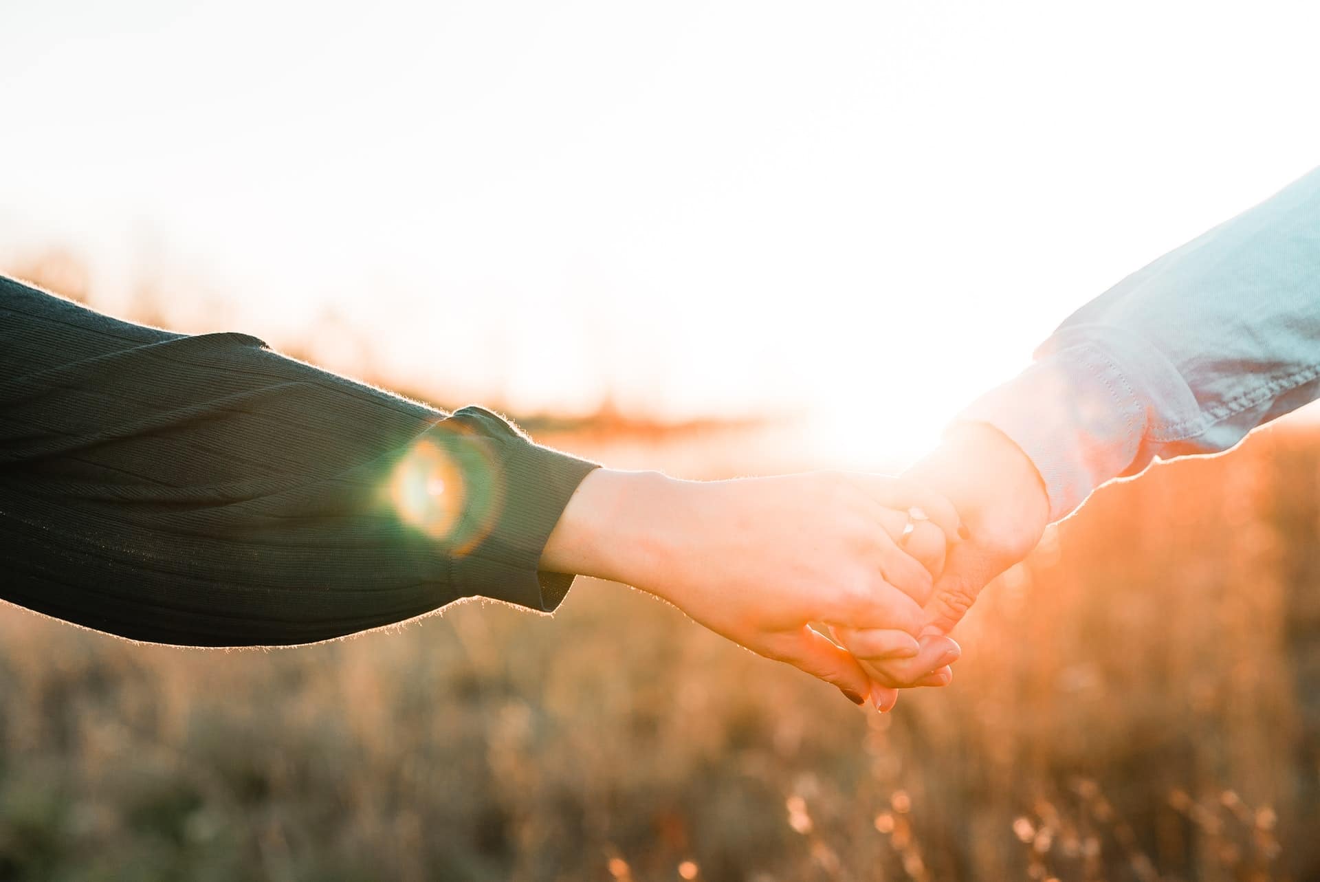 Man and woman holding hands