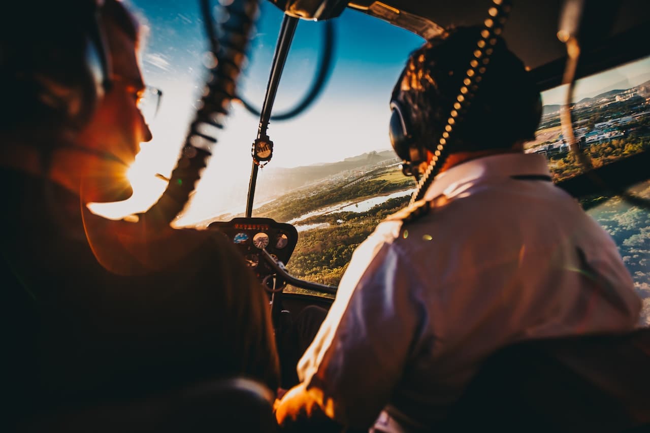 man wearing headset in helicopter