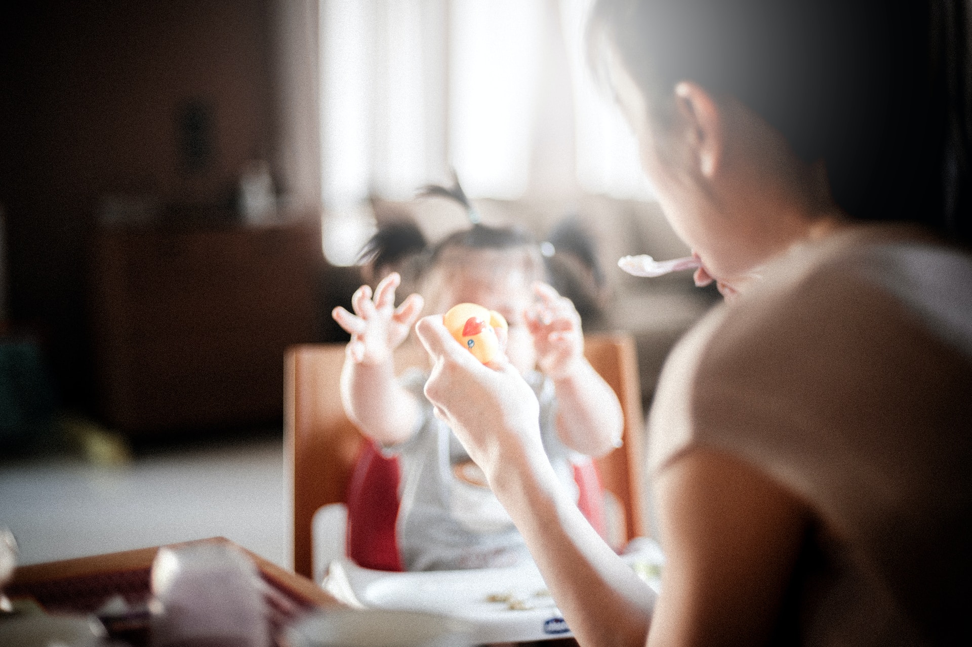selective focus on mom and baby eating