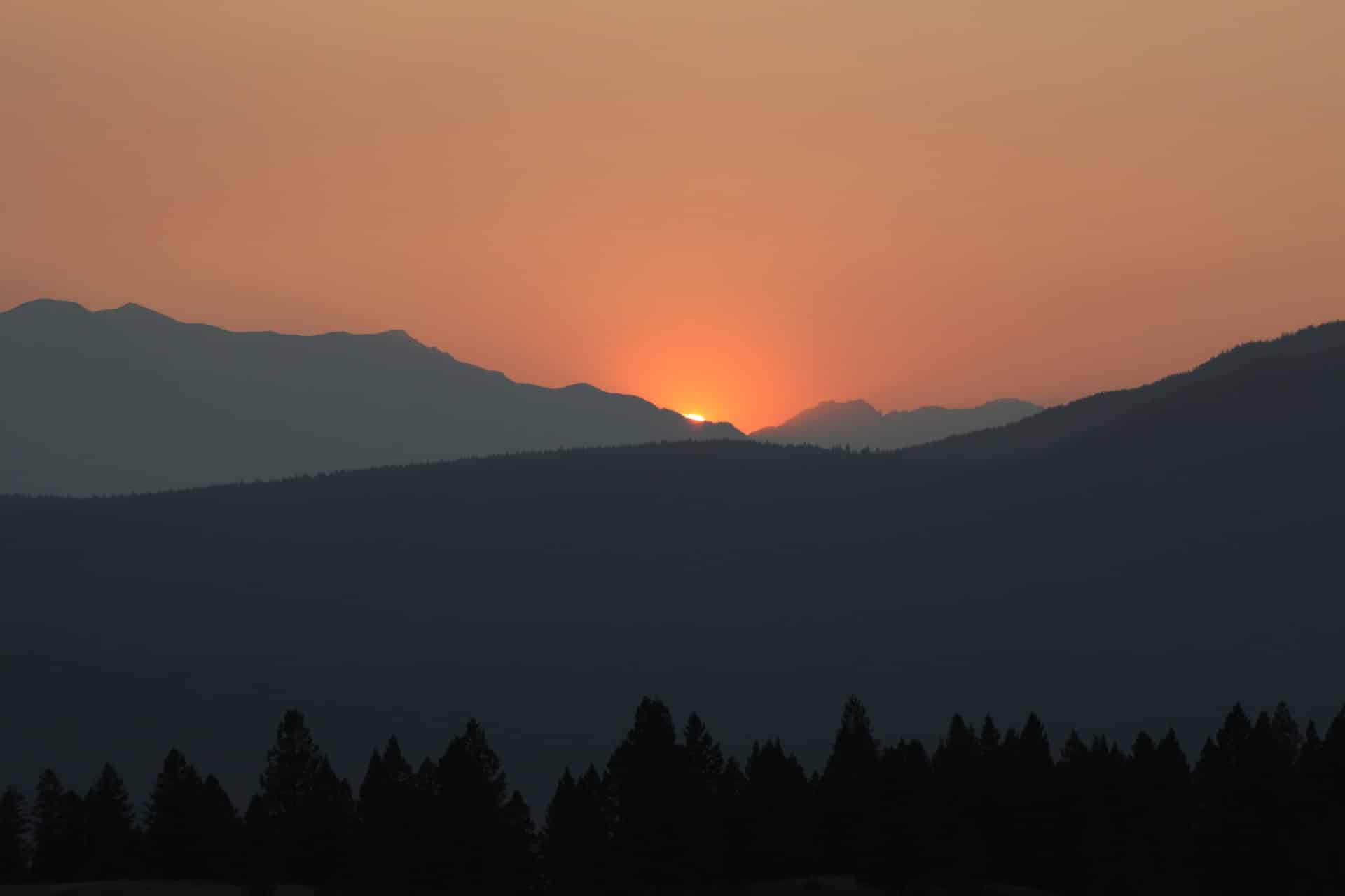 silhouette of sunset in mountains