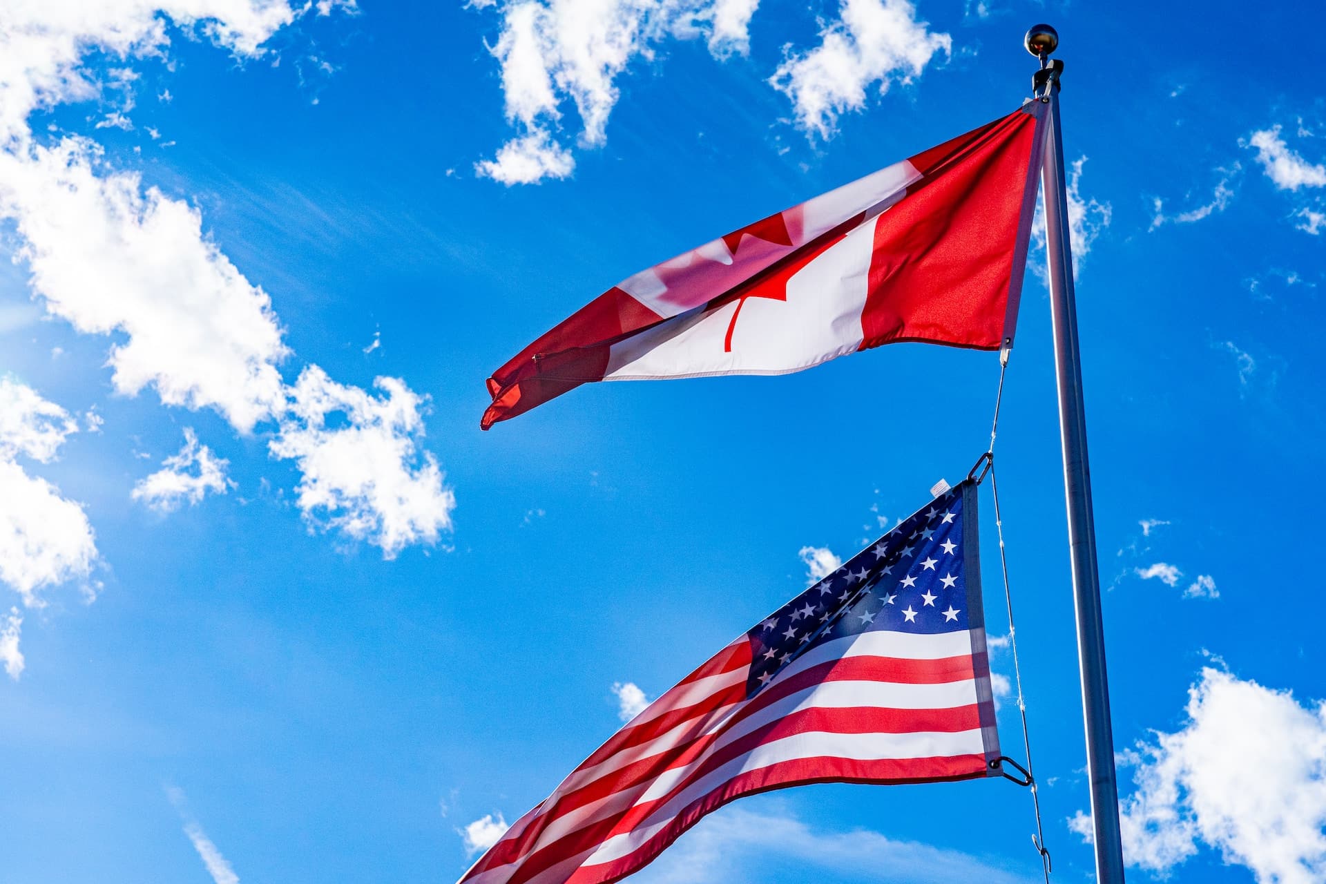 An American and Canadian flag