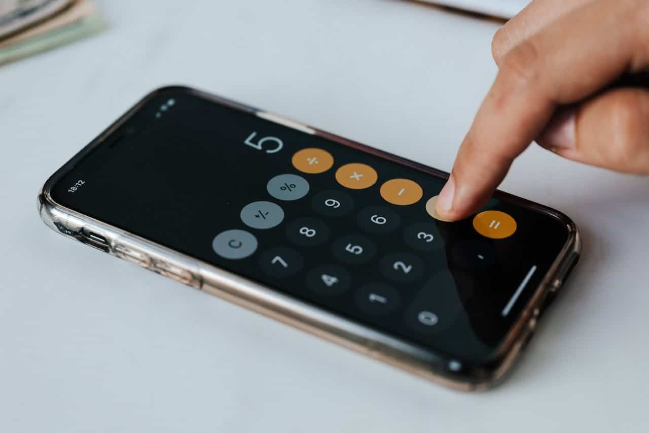 a person using a calculator on an iphone