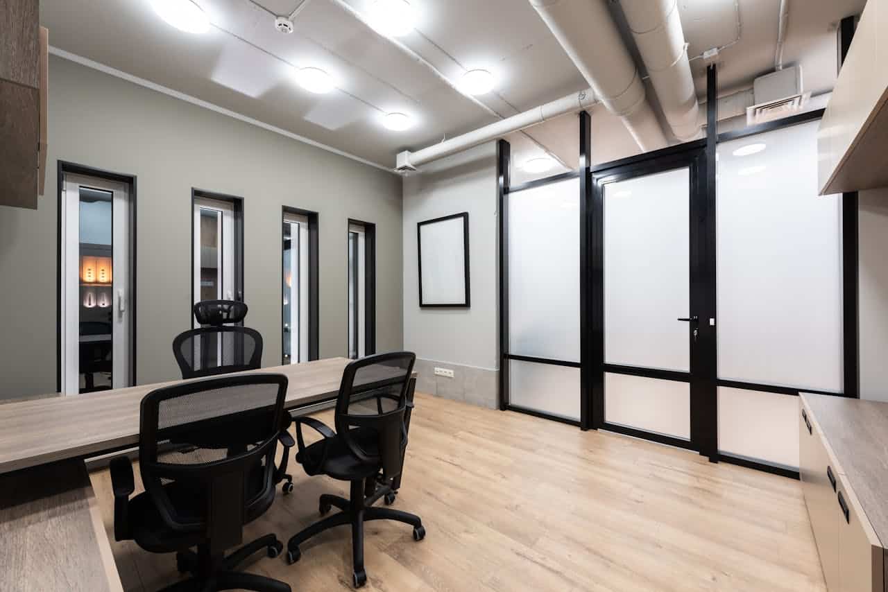 interior space of an office a table and three chairs