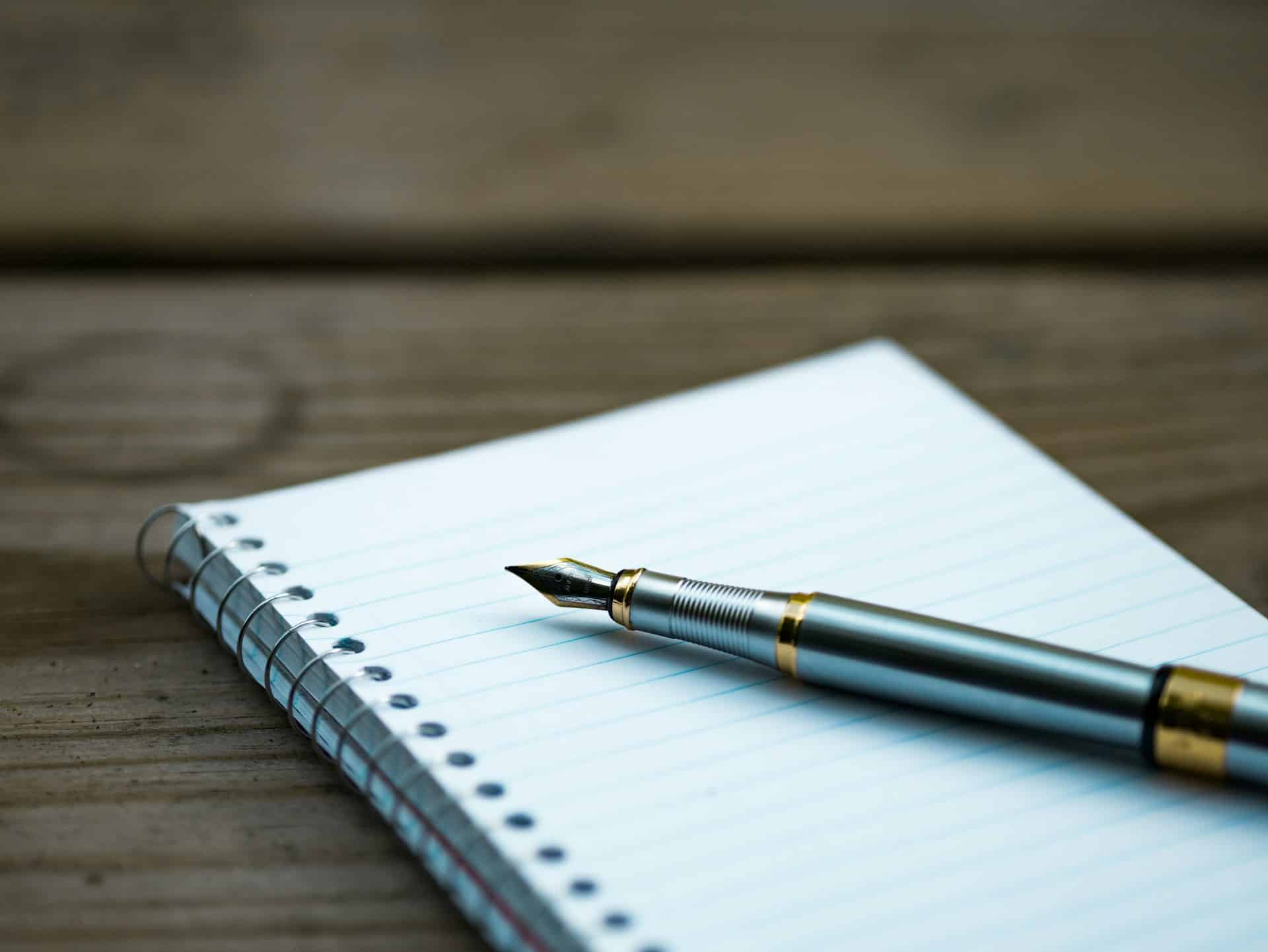 a fountain pen on lined paper