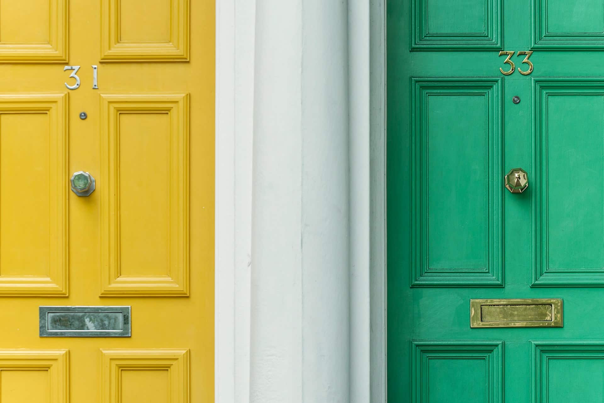 green door beside a yellow door marked with numbers