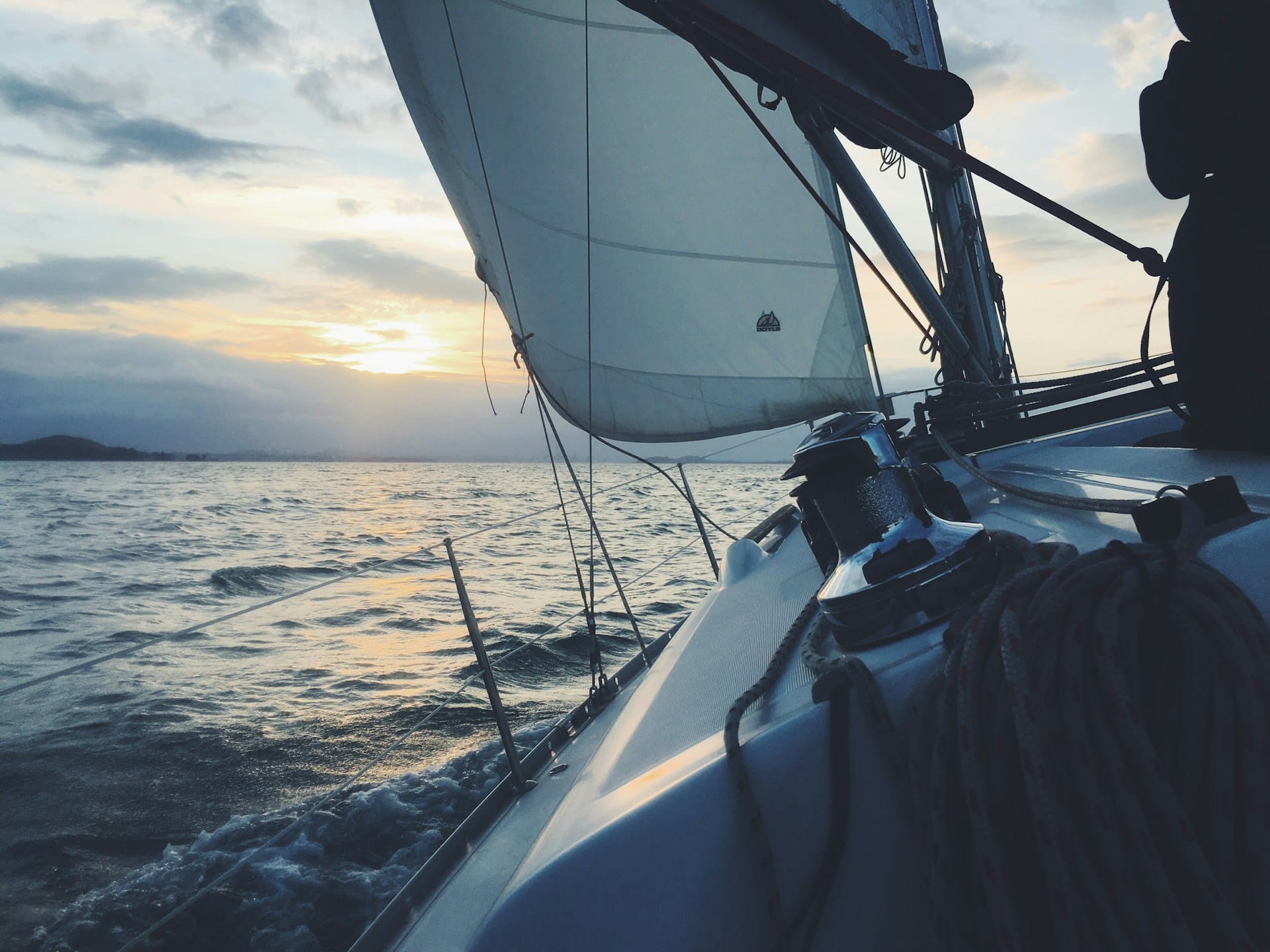 white sail on a sailboat